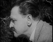Somerset Maugham Walking Around a Garden, 1920s. Creator: British Pathe Ltd