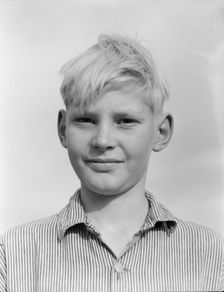 Son of migratory worker from Kansas in squatters camp near Farmersville, California, 1936. Creator: Dorothea Lange