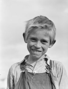 Son of cotton picker living in squatters camp near Farmersville, California, 1936. Creator: Dorothea Lange
