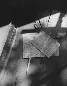 Song sheets and a fan left behind in an abandoned church on Independence Ave, Washington, D.C, 1942. Creator: Gordon Parks
