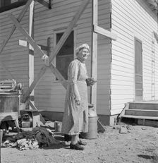 Soper grandmother helps the large family, Willow Creek area, Malheur County, Oregon, 1939. Creator: Dorothea Lange