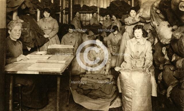Sorting uniforms at the WAAC clothing store, First World War, 1914-1918, (1933).  Creator: Unknown.