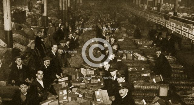 Sorting parcels at the Post Office, Mount Pleasant, London, 20th century. Artist: Unknown