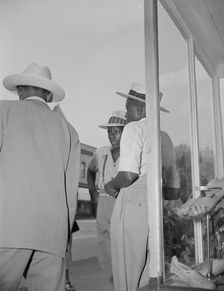 Saturday afternoon, 7th Street and Florida Avenue, N.W., Washington, D.C., 1942. Creator: Gordon Parks