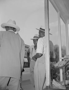 Saturday afternoon, 7th Street and Florida Avenue, N.W., Washington, D.C., 1942. Creator: Gordon Parks