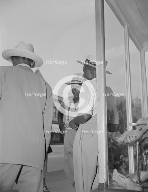 Saturday afternoon, 7th Street and Florida Avenue, N.W., Washington, D.C., 1942. Creator: Gordon Parks.