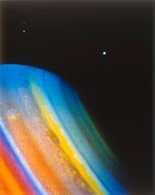 Saturn and its moon Dione, seen from the Voyager 2 spacecraft. Creator: NASA