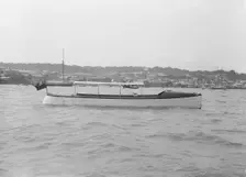 Saunders motor launch at anchor, 1914. Creator: Kirk & Sons of Cowes