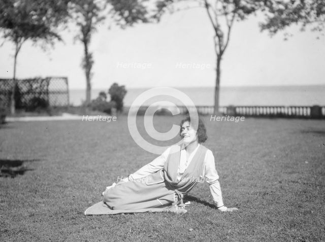 Savagoy, Henriette, seated on a lawn, 1922 July 31. Creator: Arnold Genthe.