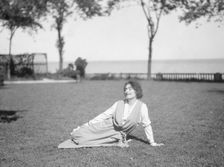Savagoy, Henriette, seated on a lawn, 1922 July 31. Creator: Arnold Genthe