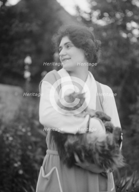 Savagoy, Henriette, with cat, outdoors, 1922 July 31. Creator: Arnold Genthe.