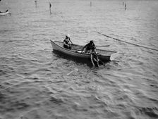 Saving a life, between 1900 and 1905. Creator: Unknown