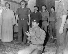Saddam Hussein praying, Karbala, Iraq, 1985