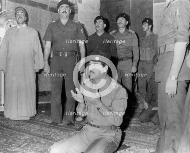 Saddam Hussein praying, Karbala, Iraq, 1985. Artist: Unknown