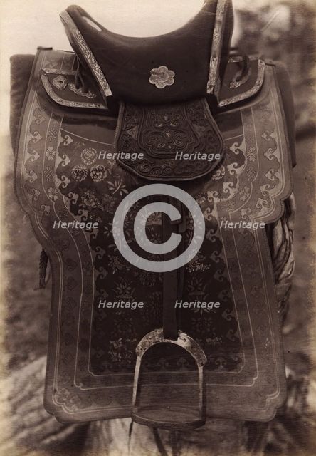 Saddle with Chinese Saddle-Cloth and Silver Mongolia Engraving over Iron, 1897. Creator: Unknown.