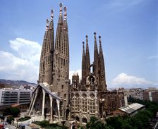 Sagrada Familia with the city in background, photo of 2000, by architect Antoni Gaudí i Cornet (1…