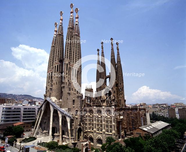 Sagrada Familia with the city in background, photo of 2000, by architect Antoni Gaudí i Cornet (1…