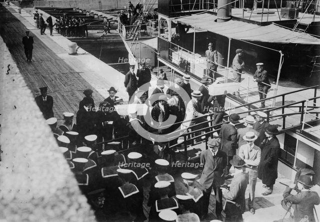 Sailors taking children in coffins from LADY GREY at Quebec, 1914. Creator: Bain News Service.