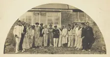 Sailors with men in drag outside a building, [between 1910 and 1919?]. Creator: Unknown