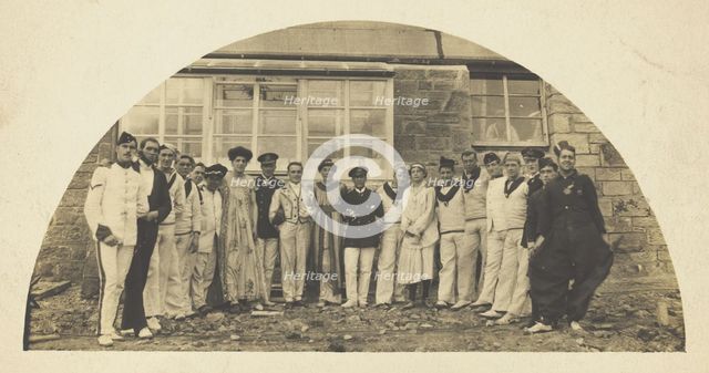 Sailors with men in drag outside a building, [between 1910 and 1919?]. Creator: Unknown.