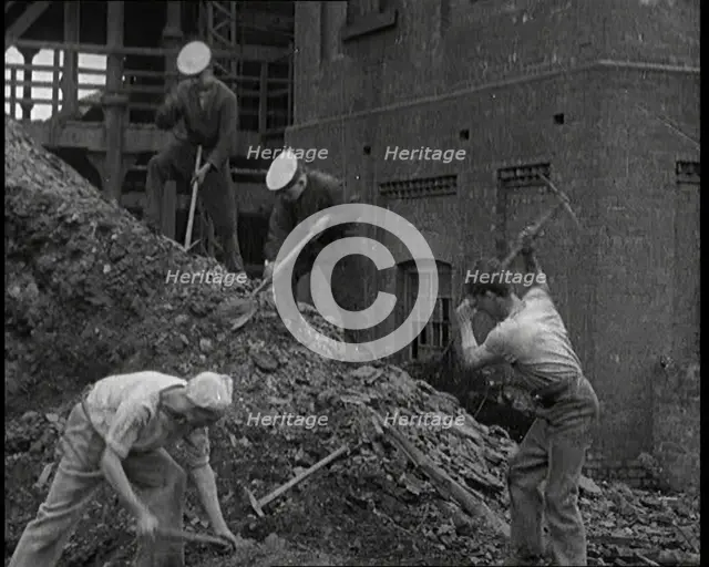 Sailors Digging Coal Outside, 1921. Creator: British Pathe Ltd.