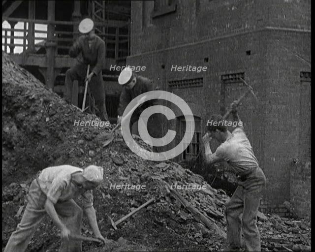 Sailors Digging Coal Outside, 1921. Creator: British Pathe Ltd.