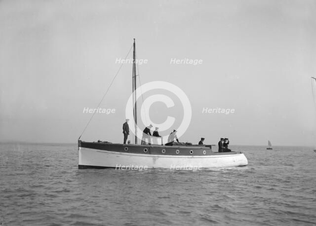 Sailors on board cabin cruiser, 1914. Creator: Kirk & Sons of Cowes.