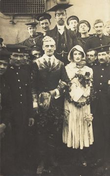 Sailors on HS Dominion, one in bridal drag, conduct a mock wedding on Christmas Day, 1915. Creator: Unknown