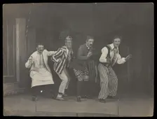 Sailors on stage in mid-pose, wearing a variety of costumes, [between 1910 and 1919?]. Creator: Unknown