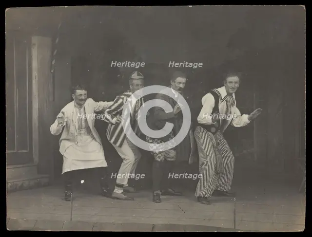 Sailors on stage in mid-pose, wearing a variety of costumes, [between 1910 and 1919?]. Creator: Unknown.