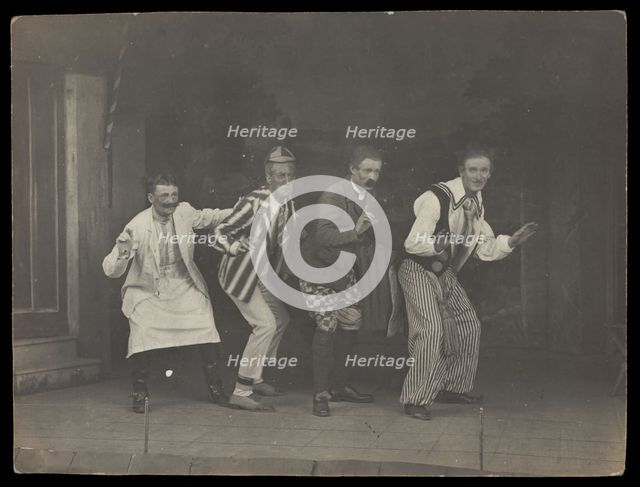 Sailors on stage in mid-pose, wearing a variety of costumes, [between 1910 and 1919?]. Creator: Unknown.