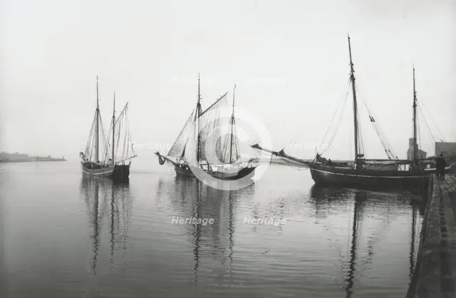 Sailing ships leave the harbour of Landskrona in dead calm conditions, Sweden, 1903. Creator: Unknown.
