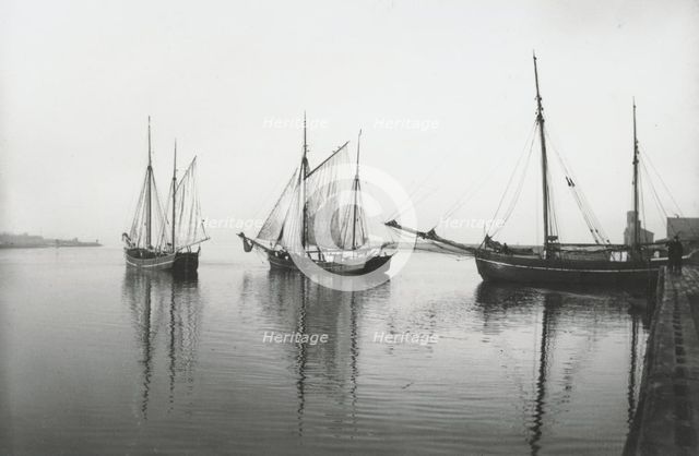Sailing ships leave the harbour of Landskrona in dead calm conditions, Sweden, 1903. Artist: Unknown