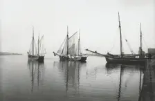 Sailing ships leave the harbour of Landskrona in dead calm conditions, Sweden, 1903. Creator: Unknown
