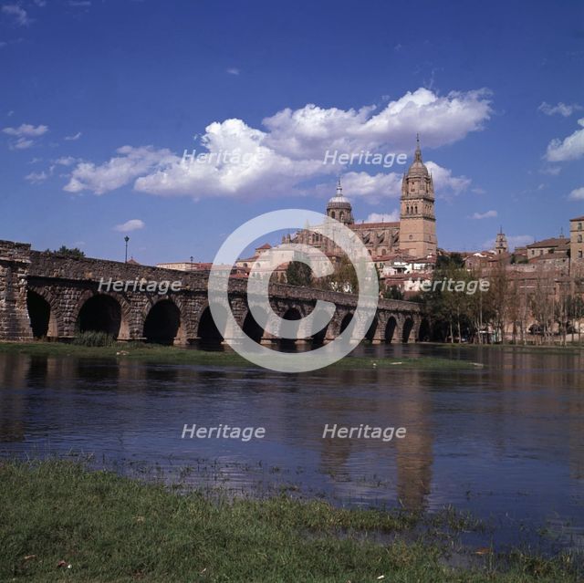 Salamanca. View of the Roman bridge over the river Tormes with the cathedral in the background.