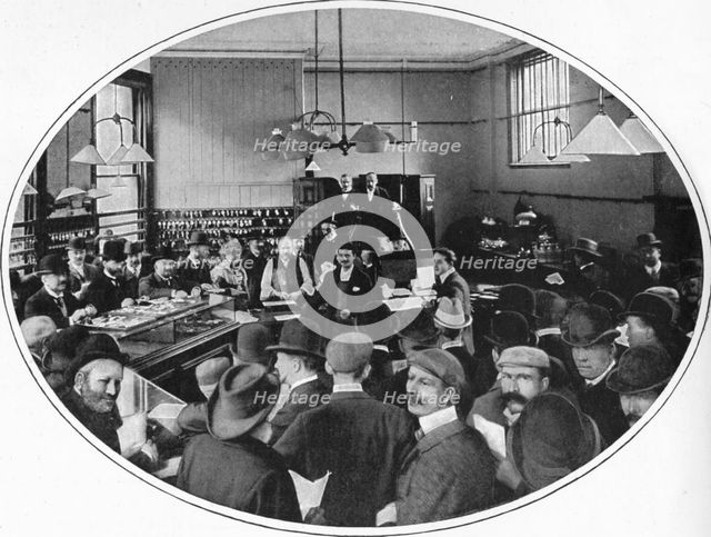 Sale of unredeemed goods at Debenham, Storr and Sons auction rooms, London, c1903 (1903). Artist: Unknown.