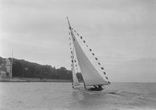 Saling yacht Asphodel (K5) with prize flags, 1922. Creator: Kirk & Sons of Cowes
