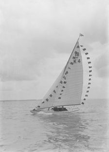 Saling yacht Asphodel (K5) with prize flags, 1922. Creator: Kirk & Sons of Cowes