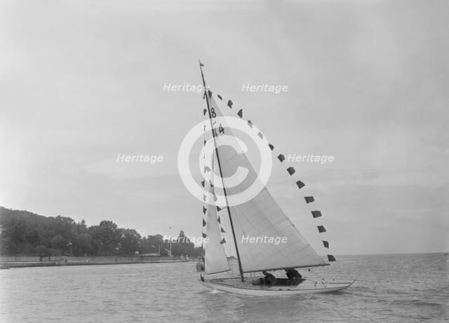 Saling yacht 'Asphodel' (K5) with prize flags, 1922. Creator: Kirk & Sons of Cowes.