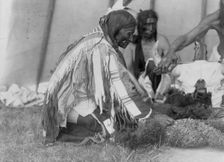 Saliva, Slow Bull (in background), Picket Pin's arm, c1907. Creator: Edward Sheriff Curtis