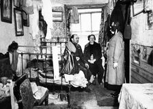 Salvation Army visiting a resident in Notting Hill, London, c1900