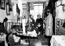 Salvation Army visiting a resident in Notting Hill, London, c1900. Creator: Unknown