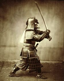 Samurai with raised sword, c1860. Creator: Felice Beato