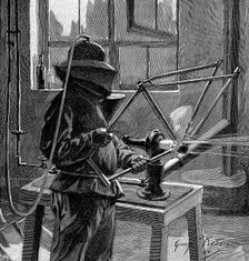 Sandblasting the joints of a bicycle frame, France, 1896. Creator: Unknown