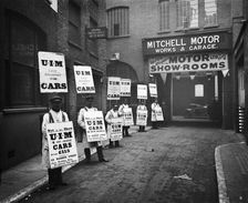 Sandwich board men advertising outside Mitchell Motors, 114 Wardour Street, London, 1910. Artist: Bedford Lemere and Company