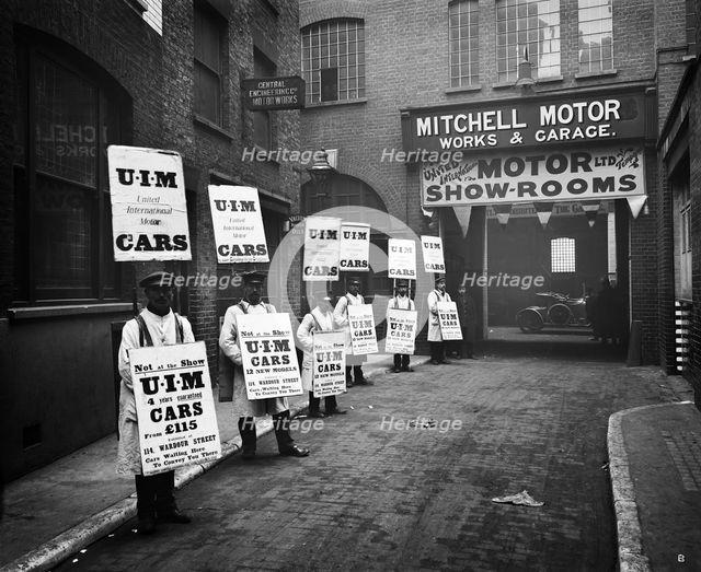 Sandwich board men advertising outside Mitchell Motors, 114 Wardour Street, London, 1910. Artist: Bedford Lemere and Company.