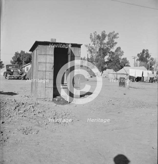 Sanitary facilities in camp of carrot pullers, near Holtville, Imperial Valley, California, 1939. Creator: Dorothea Lange.