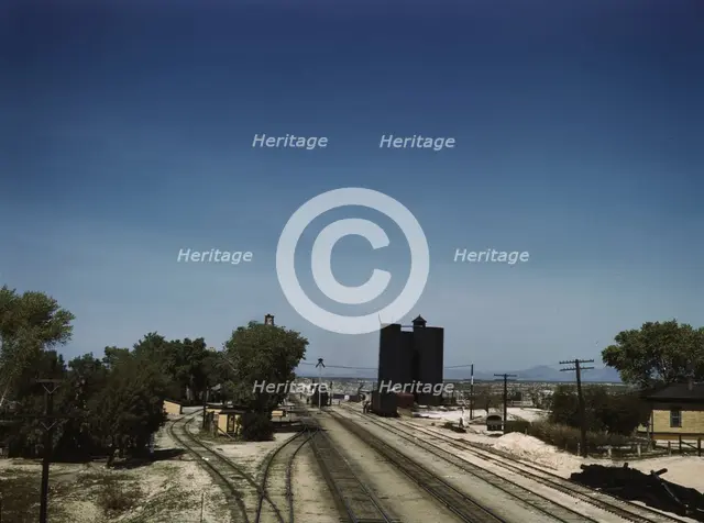 Santa Fe R.R. going through Yucca, Arizona; a watering and refueling stop, 1943. Creator: Jack Delano.