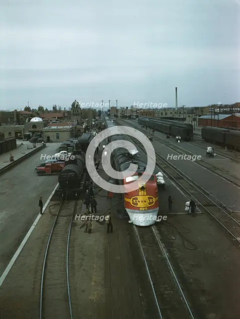 Santa Fe R.R. streamliner, the "super Chief," being serviced..., Albuquerque, N.Mexico , 1943. Creator: Jack Delano.