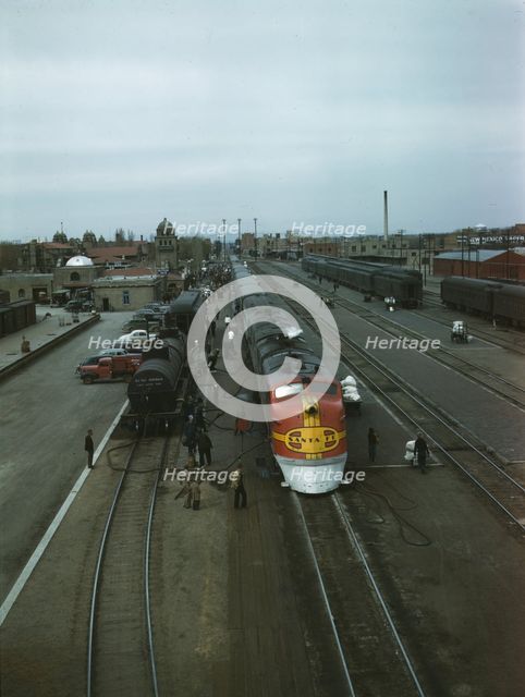 Santa Fe R.R. streamliner, the "super Chief," being serviced..., Albuquerque, N.Mexico , 1943. Creator: Jack Delano.